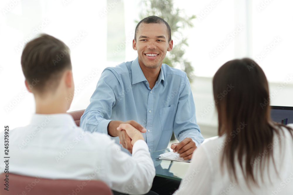 closeup.handshake Manager and the client in the office