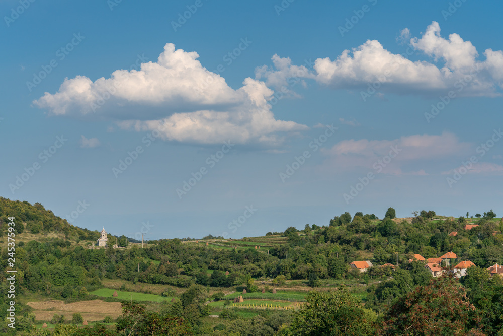landscape with blue sky and white clouds