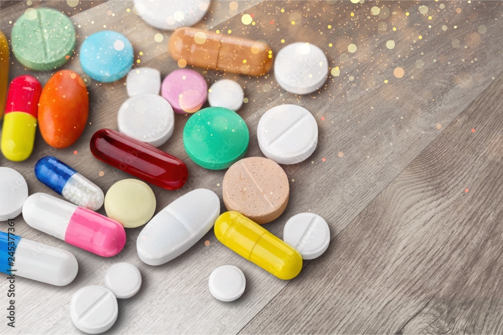 Colorful pills and tablets on background Colorful pills and tablets on background
