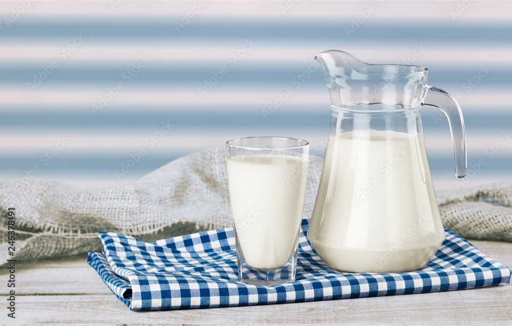 Glass of milk and bottle on background Glass of milk and bottle on background