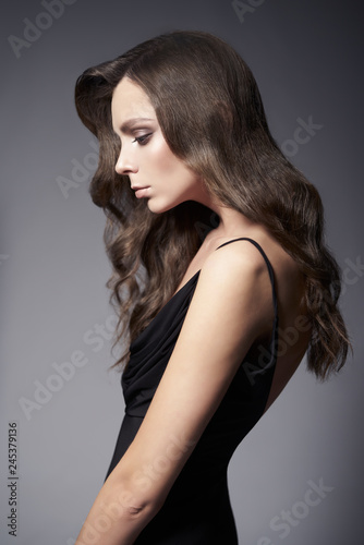 Fashion photo of beautiful lady in black dress.