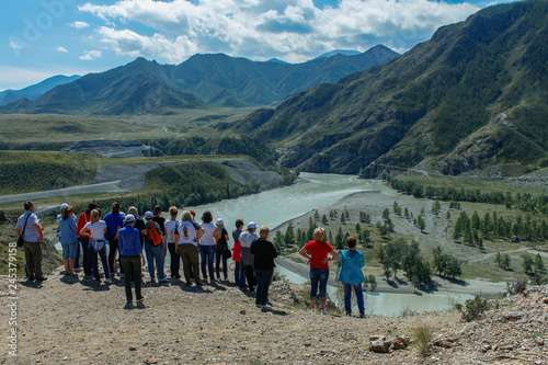 A group of tourists admires the landscape, Altai, Siberia