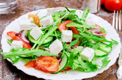 salad with arugula, chicken breast and crackers photo