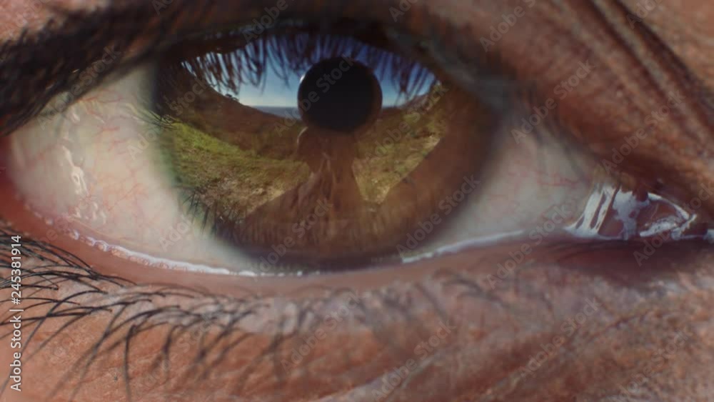 close up eye opening beautiful brown iris with reflection