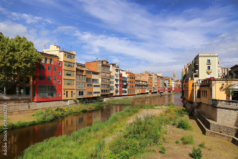 Fototapeta premium Colorful houses and Eiffel bridge and river Onyar in Girona