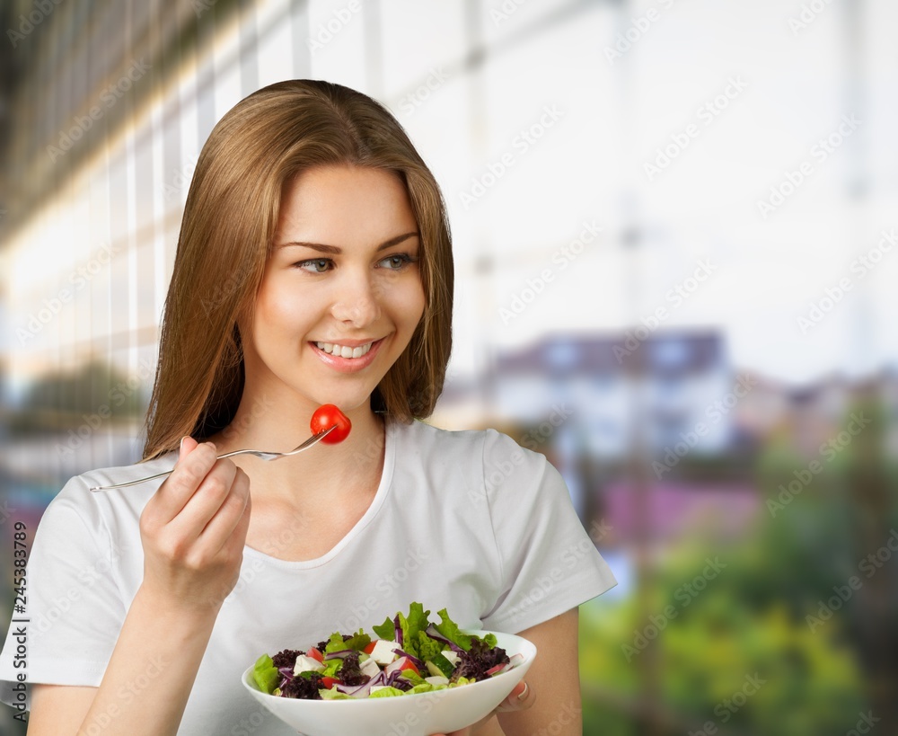 Attracive young woman enjoying tea and fruits on breakfast Attracive young woman enjoying tea and fruits on breakfast