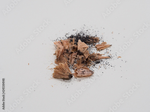 Debris from pencil sharpening on white background 
