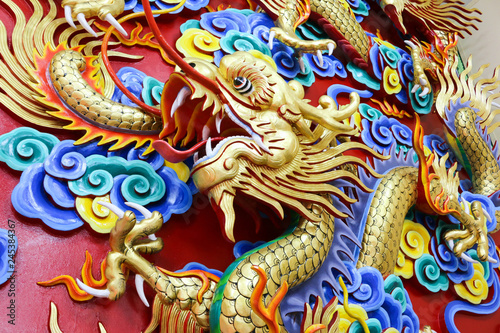 Chinese Dragon sculpture on the wall © pongpisit