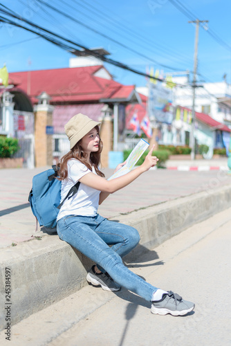 A woman is looking at a map for traveling,traveling in Thailand,traveling in Chiang mai 