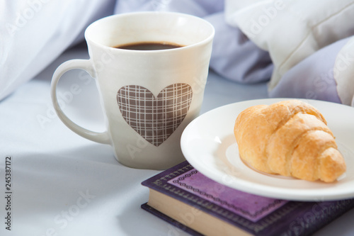 Bedroom on the bed  morning coffee. Happiness. A heart.