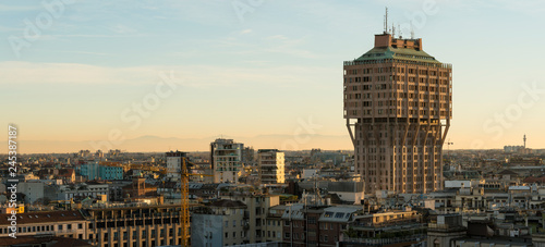 Milan (Italy) skyline with Velasca Tower (Torre Velasca) at sunset. This famous skyscraper, approximately 100 metres tall, was built in the fifties. photo