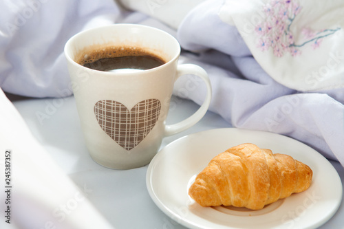 Bedroom on the bed  morning coffee. Happiness. A heart.