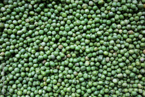 Fresh green peas background. Vegetarian healthy food texture. Vegetables low fat diet.