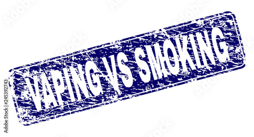 VAPING VS SMOKING stamp seal print with distress texture. Seal shape is a rounded rectangle with frame. Blue vector rubber print of VAPING VS SMOKING caption with dirty texture.