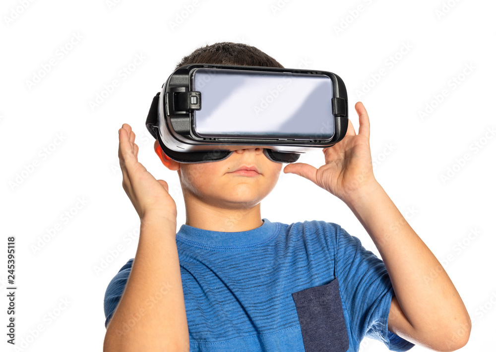 virtual reality goggles on young boy white background