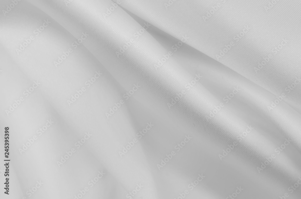 Smooth elegant white silk or satin luxury cloth texture. Can use as wedding background.
