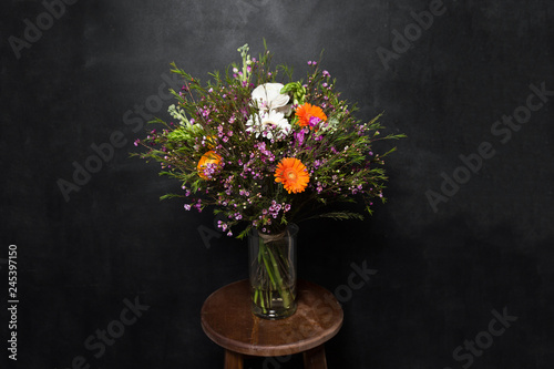 flower Ikibana on a black background  bouquet in a glass vase