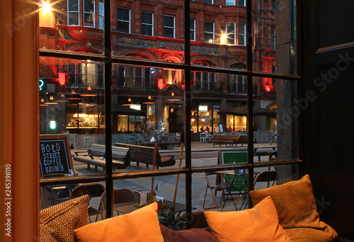 Night view from cafe window to old European street