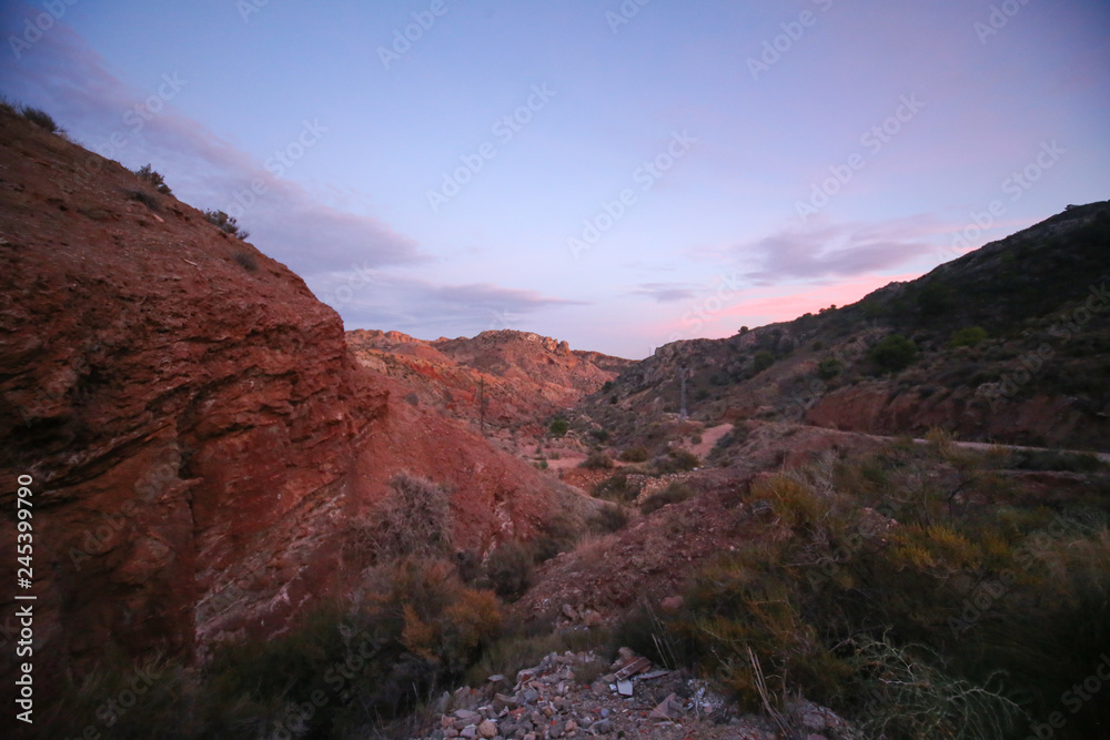 Obraz premium red rocks canyon with red and blue sunset