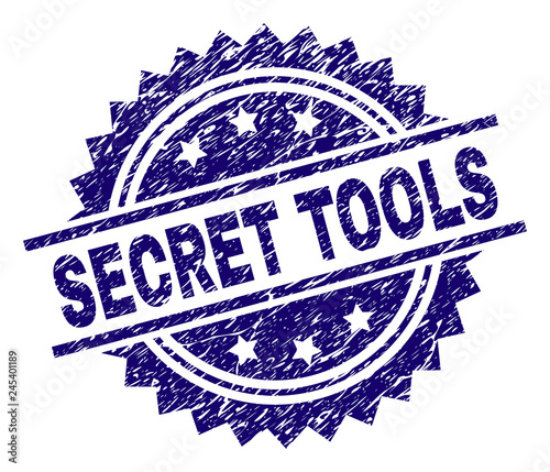 SECRET TOOLS stamp seal watermark with distress style. Blue vector rubber print of SECRET TOOLS tag with unclean texture.