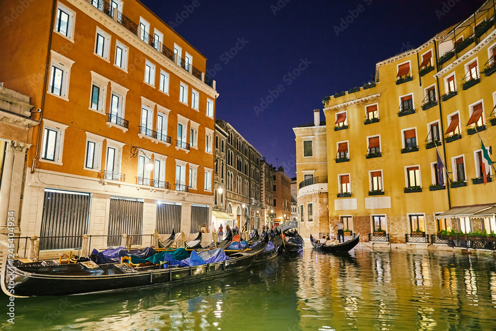 Night cityscape of Venice city colorful buildings on water