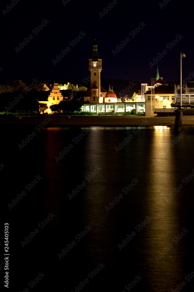 The coast with a lighthouse by night, long-exposure, Sopot, Poland