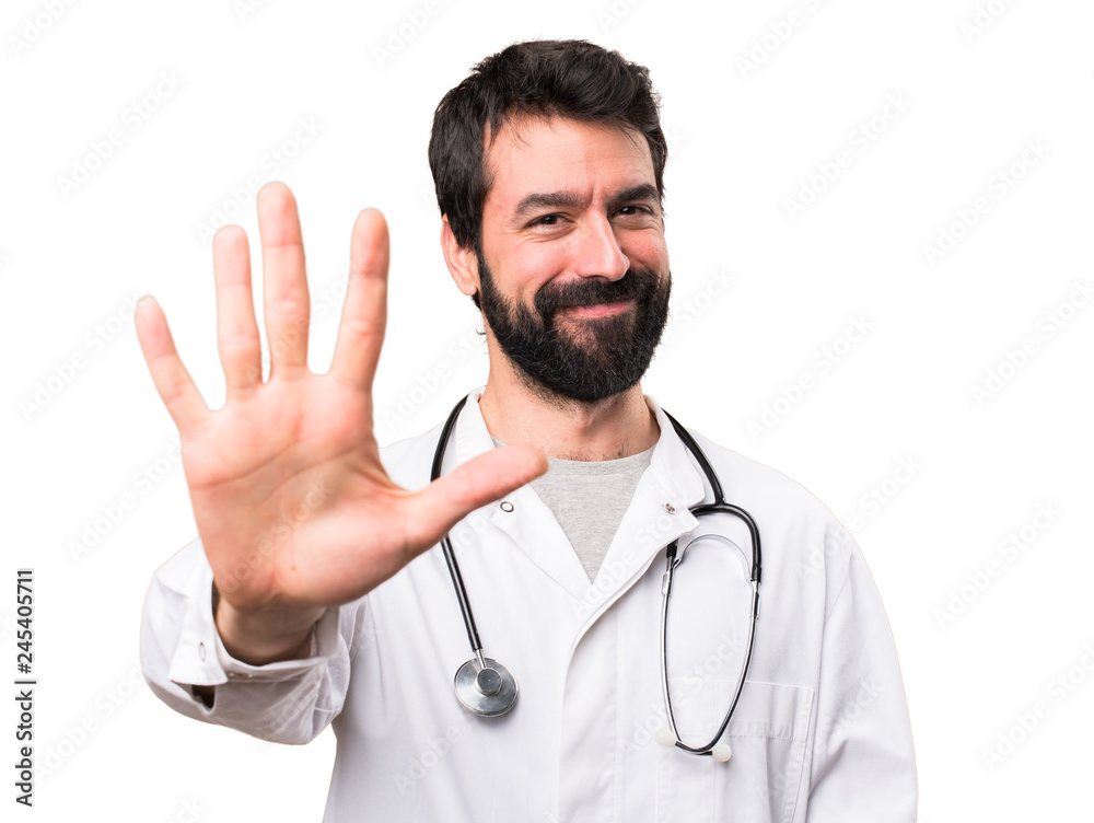Young doctor counting five on white background Young doctor counting five on white background