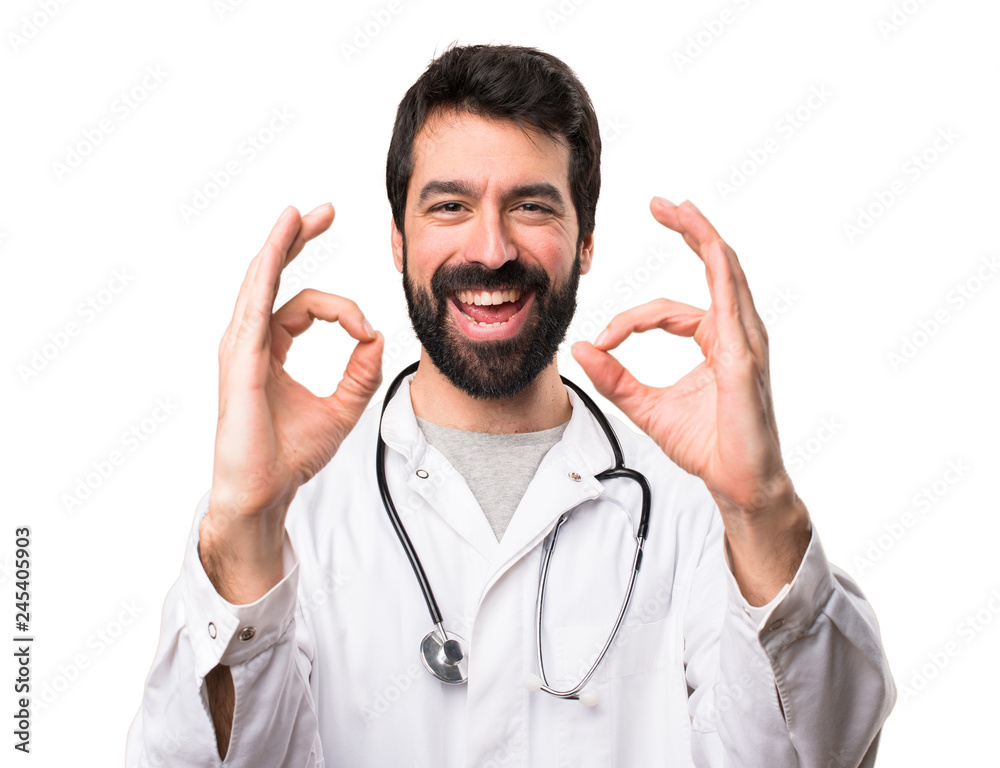 Young doctor making OK sign on white background Young doctor making OK sign on white background