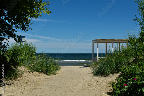 Entrance to the beach with a wooden building