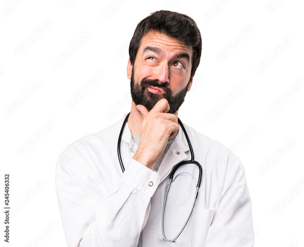 Young doctor thinking on white background Young doctor thinking on white background