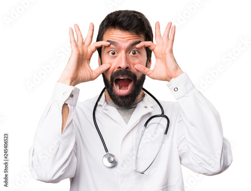 Young doctor showing something on white background