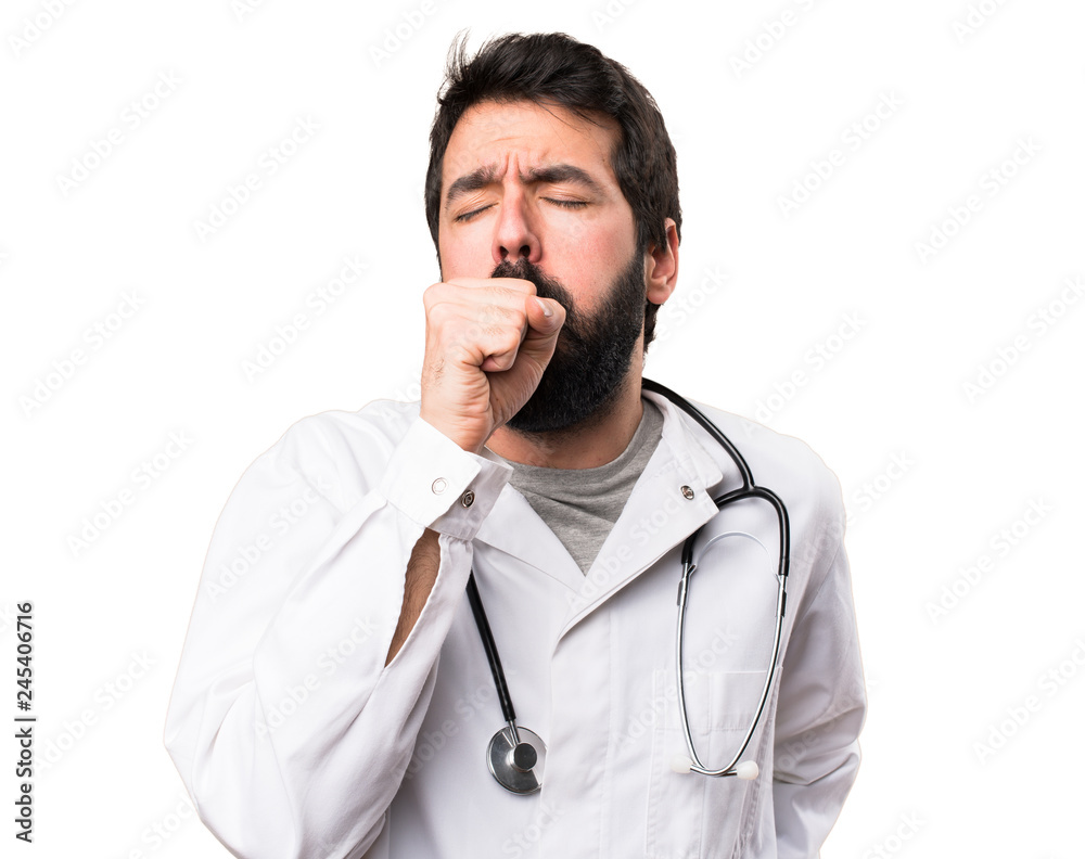 Young doctor coughing a lot on white background