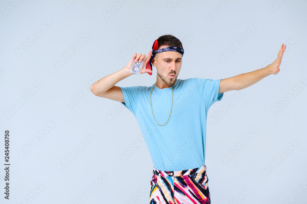 fashionable man in bright pants, a manifestation of emotions of joy, gestures with hands a place for the text fashionable man in bright pants, a manifestation of emotions of joy, gestures with hands a place for the text
