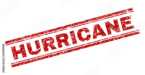 HURRICANE seal print with corroded texture. Red vector rubber print of HURRICANE text with unclean texture. Text label is placed between double parallel lines.