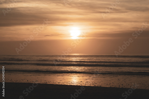 Sunset over main beach in Agadir Morocco showing silhouettes and reflections © Pluto119