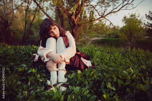 Canvas Print Beautiful lonely girl in a vintage dress. Evening sadness.