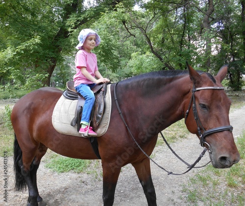 little girl on horseback