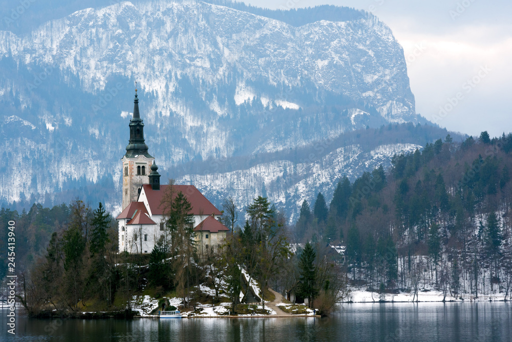 Monastery on the island in winter. Bled lake Slovenia