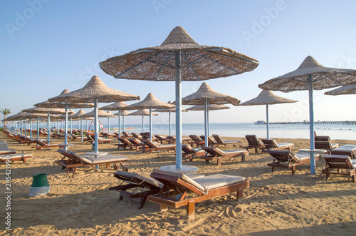 Many beach umbrella from wicker and lounge Hurgada  Egypt