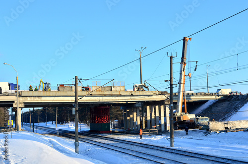 View of the construction of a road bridge over the railway in winter © MaxSafaniuk