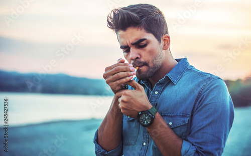 Man smoking cigarette © bobex73