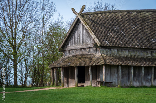 Old viking longhouse in spring photo