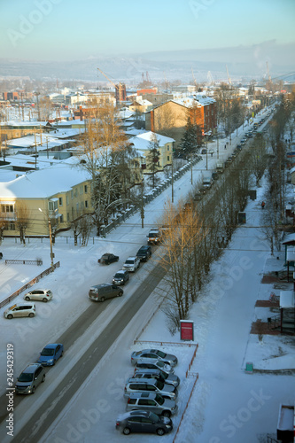 Automobile traffic jam in the Siberian city in winter