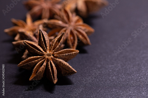 Close up of star anise seeds on grey