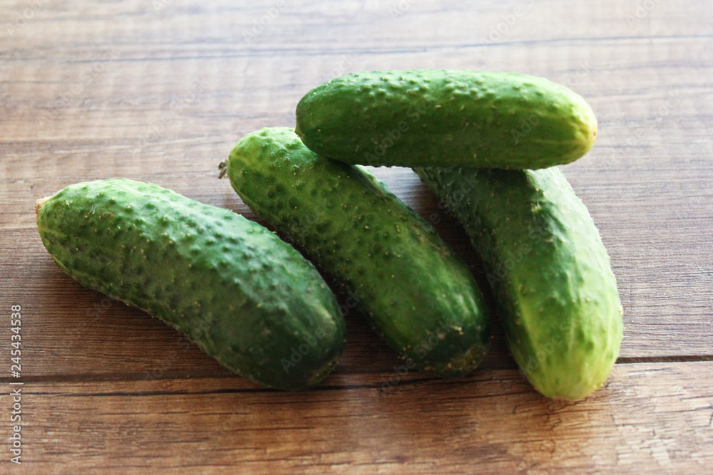 Cucumber on wooden background, vegetables Cucumber on wooden background, vegetables