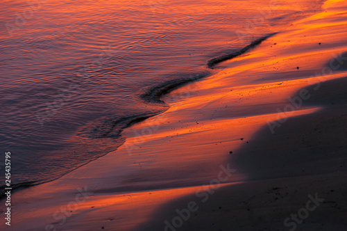 Red waves at sunset photo