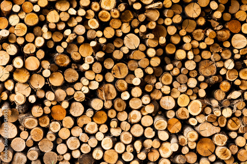 ends of logs wooden background. toning. wood in the stack. - Image