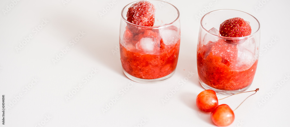 Red berry lemonade in glass jar on a wooden background with lemon slices, honey and ice. Top view Red berry lemonade in glass jar on a wooden background with lemon slices, honey and ice. Top view