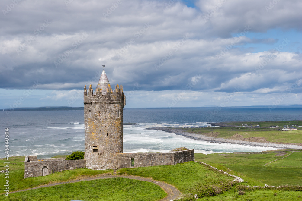 Doonagore Castle located in Burren region in County Clare, Ireland above Atlantic Ocean