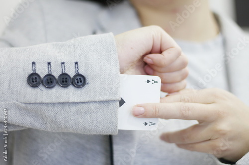 Concept image of a person hiding an ace up their sleeve.